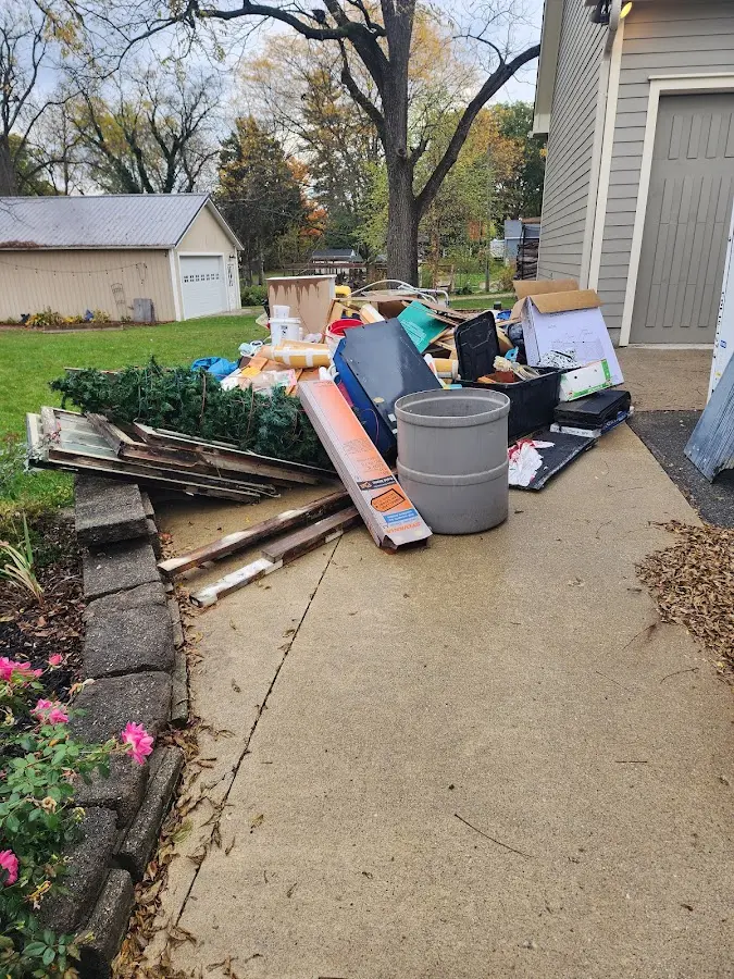 Dumpster being loaded with debris for Demolition Dumpster Rental in Blakely